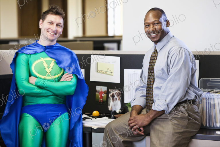A caucasian businessman office super hero and his black business man partner.