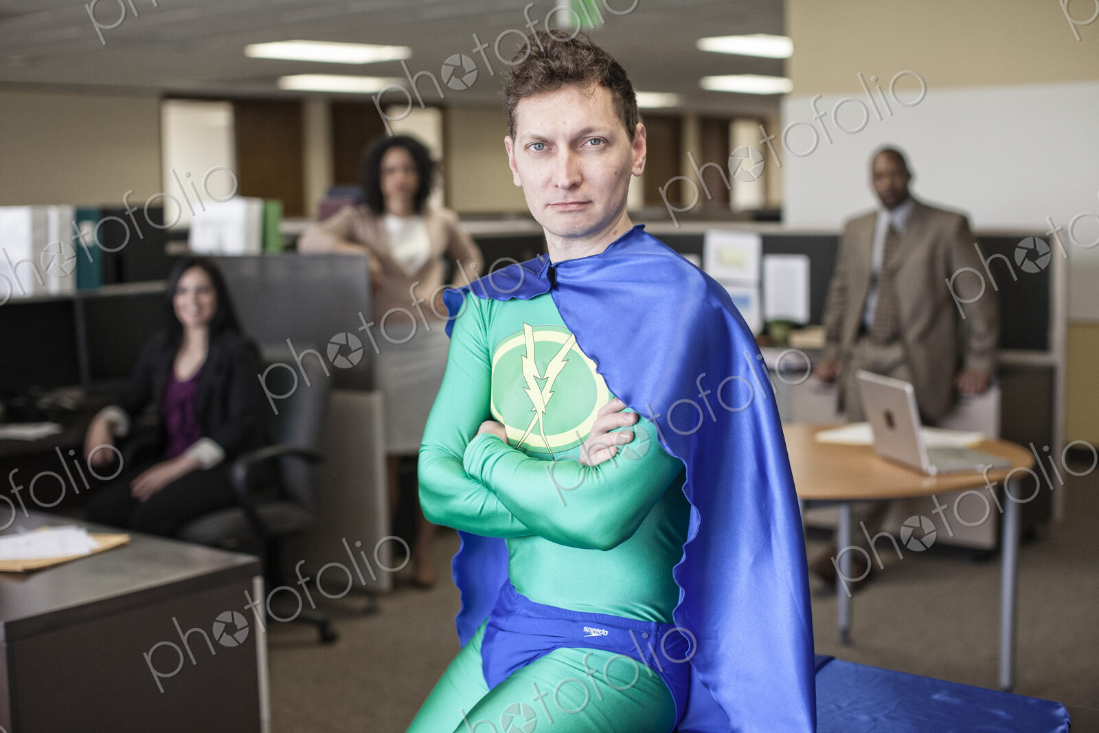 A caucasian businessman office super hero and his office staff