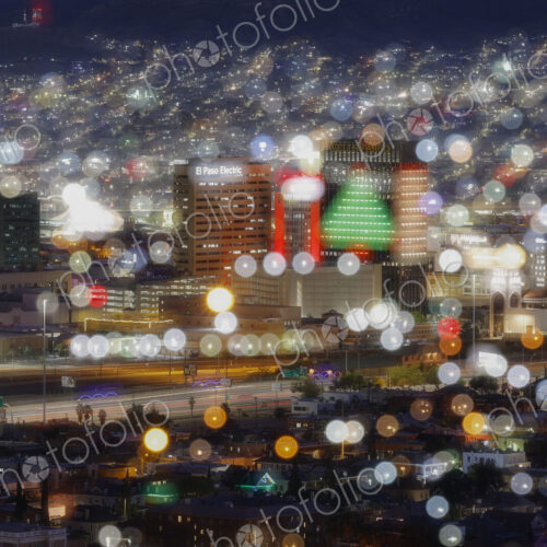 A city at night, blurred view, pinpoints of light, a cityscape, buildings and colours. A city at night, blurred view, pinpoints of light, a cityscape, buildings and colours.