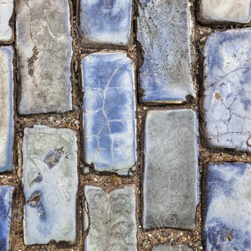A close-up of weathered blue cobblestones in Old San Juan, Puerto Rico. These historic…
