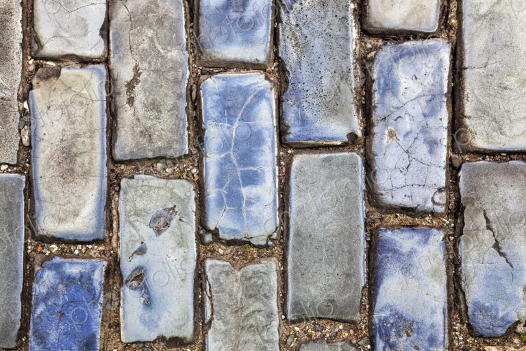 A close-up of weathered blue cobblestones in Old San Juan, Puerto Rico. These historic…
