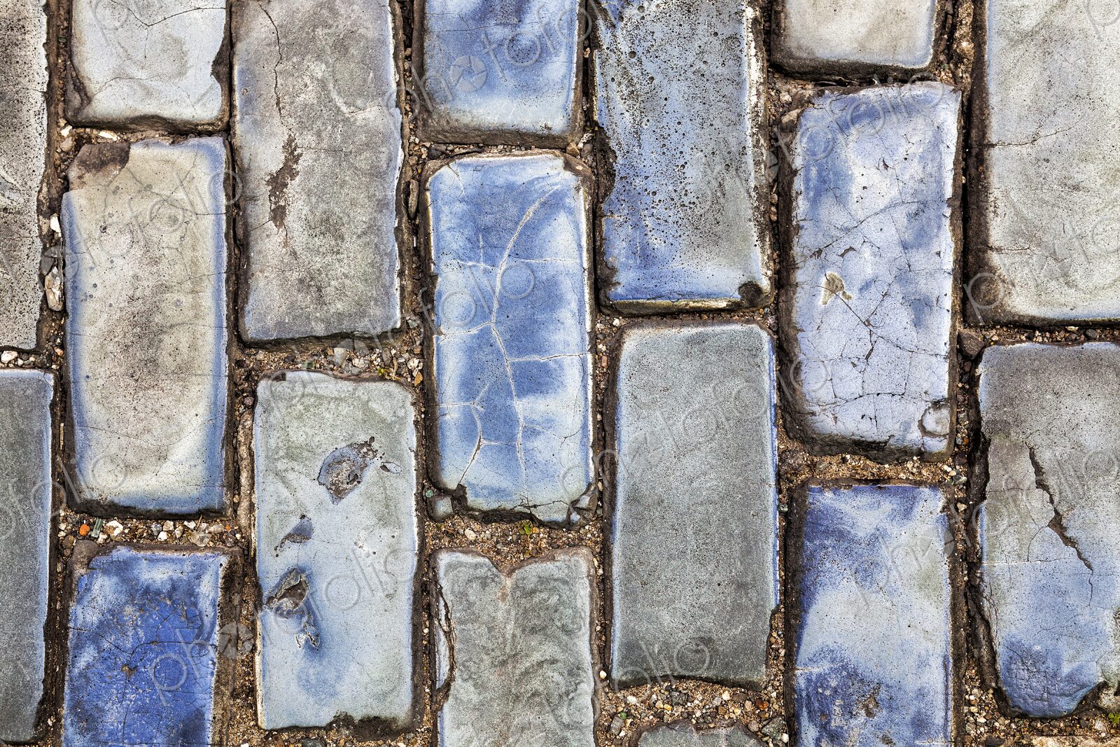 A close-up of weathered blue cobblestones in Old San Juan, Puerto Rico. These historic…