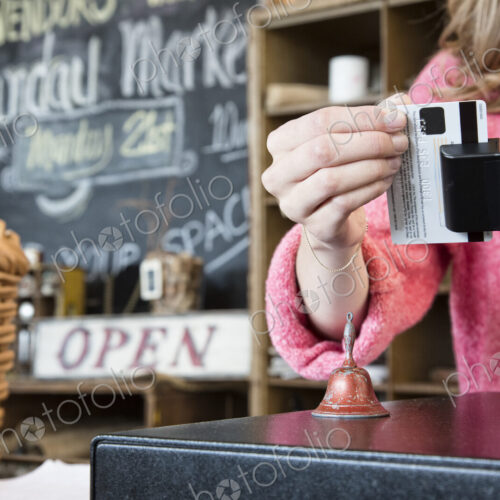 A closeup of a credit card being swiped in a credit card transaction.