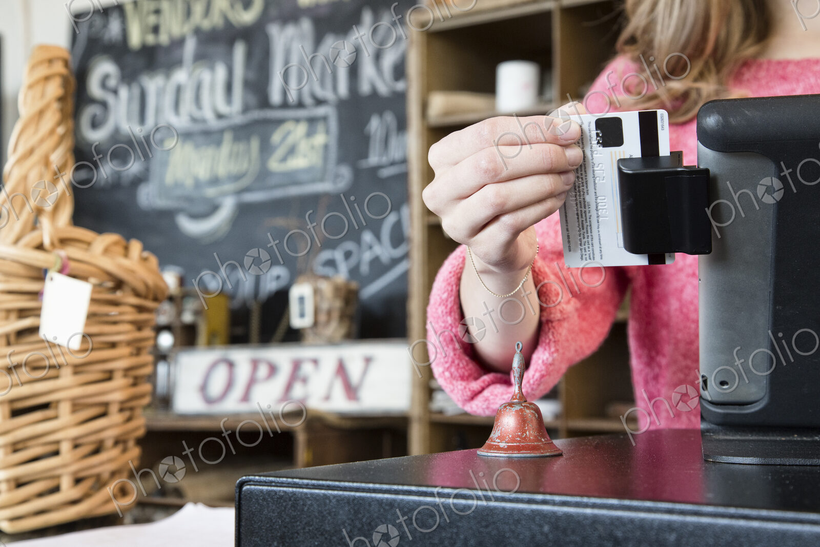 A closeup of a credit card being swiped in a credit card transaction.