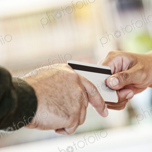 A closeup of a credit card transaction taking place. A closeup of a credit card transaction taking place.