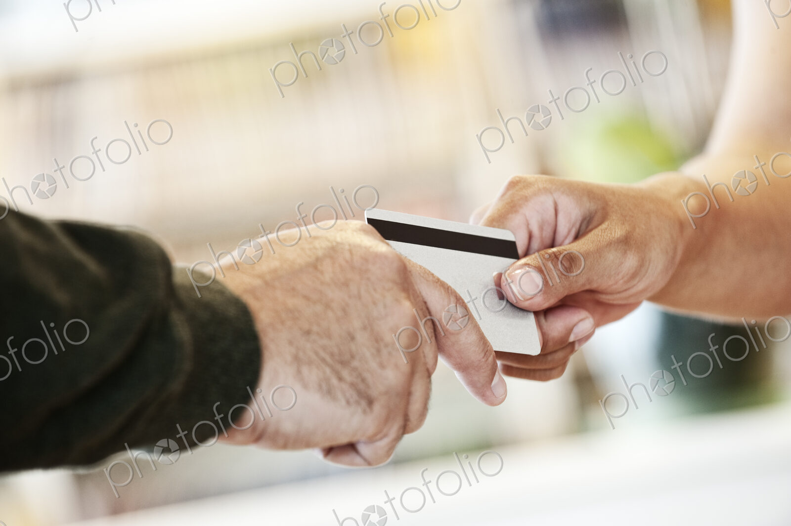A closeup of a credit card transaction taking place.