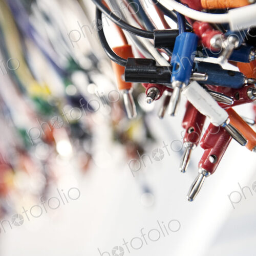 A closeup of electrical leads at a research and development site. A closeup of electrical leads at a research and development site.