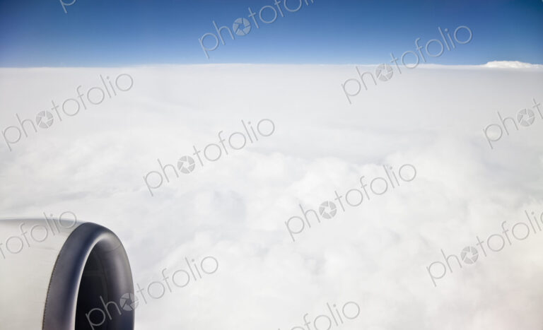 A cloudscape seen from an airplane window.