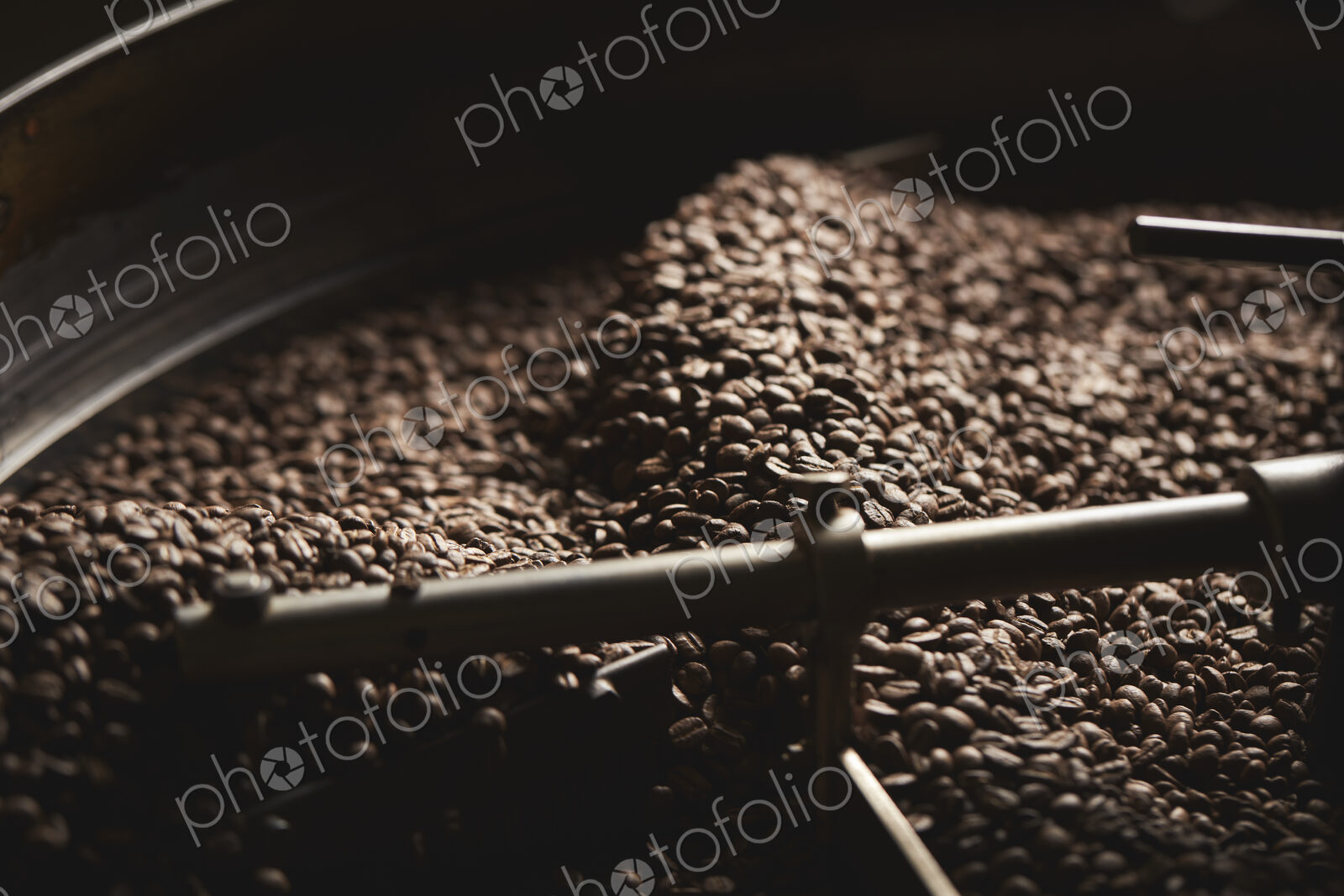 A coffee shop. A drum of roasting coffee beans.
