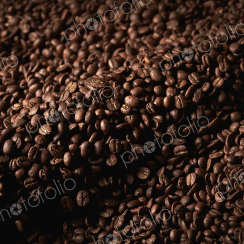 A coffee shop. A drum of roasting coffee beans. A coffee shop. A drum of roasting coffee beans.