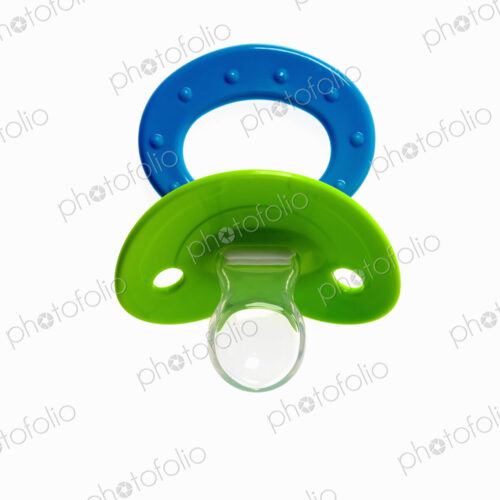 A coloured plastic baby pacifier, dummy or soother.