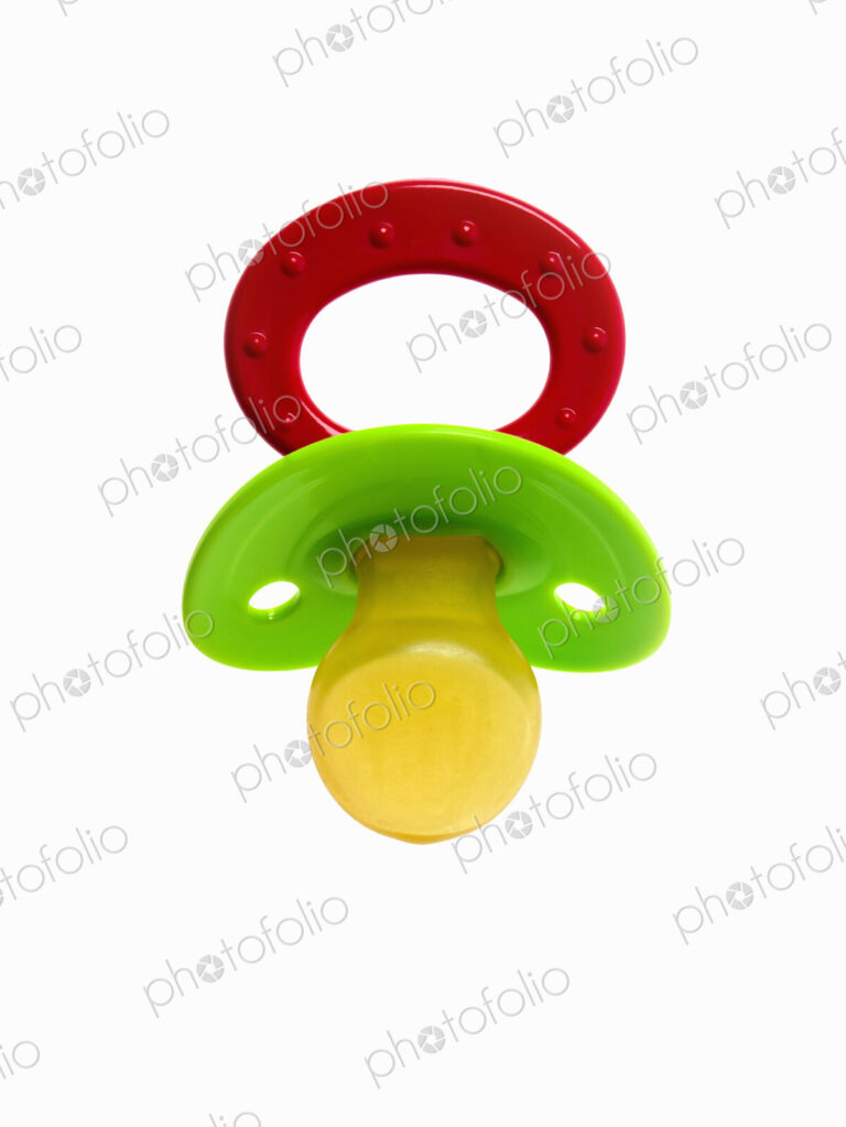 A coloured plastic baby pacifier, dummy or soother.