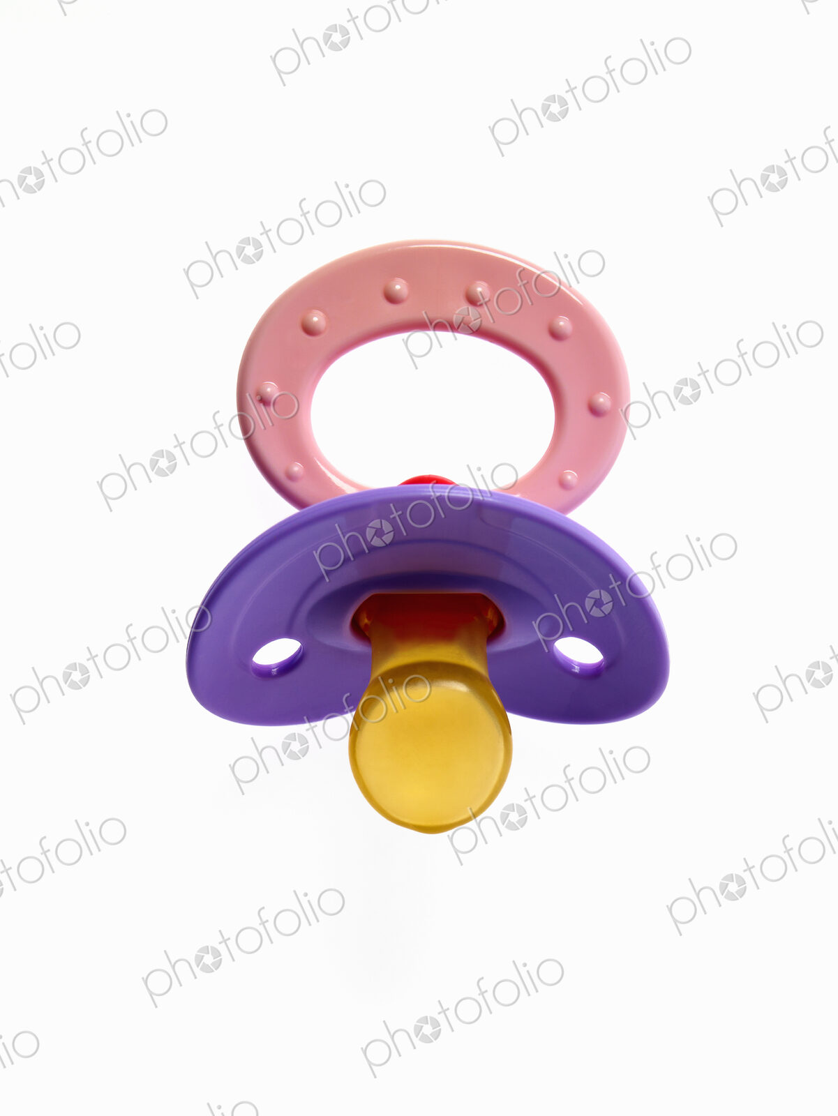 A coloured plastic baby pacifier, dummy or soother.