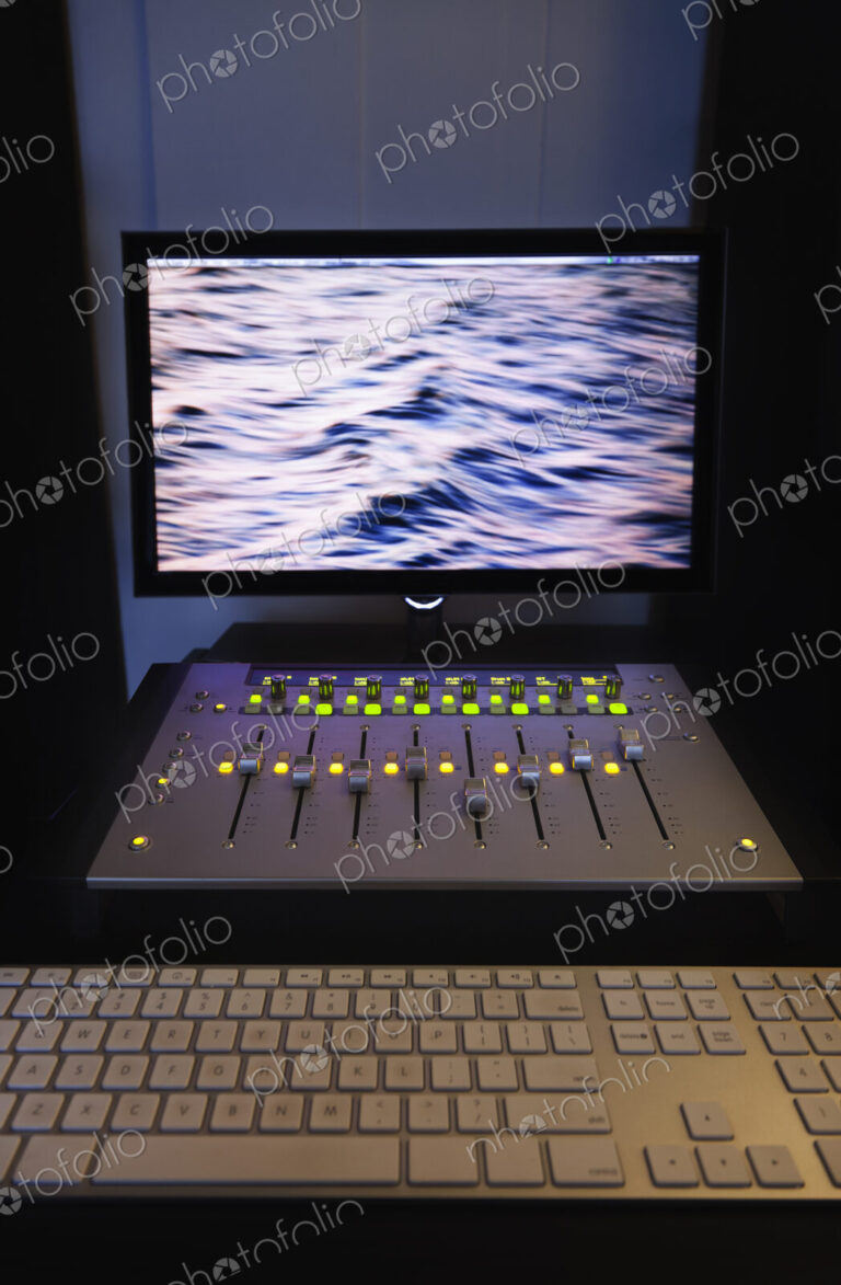 A computer workstation with sound board, speakers, headphones, recording deck and…