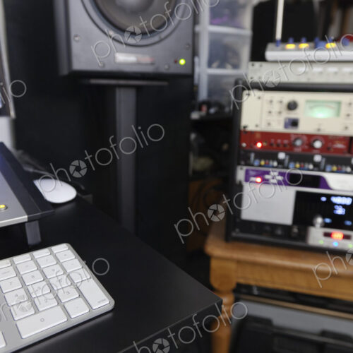A computer workstation with sound board, speakers, headphones, recording deck and… A computer workstation with sound board, speakers, headphones, recording deck and…