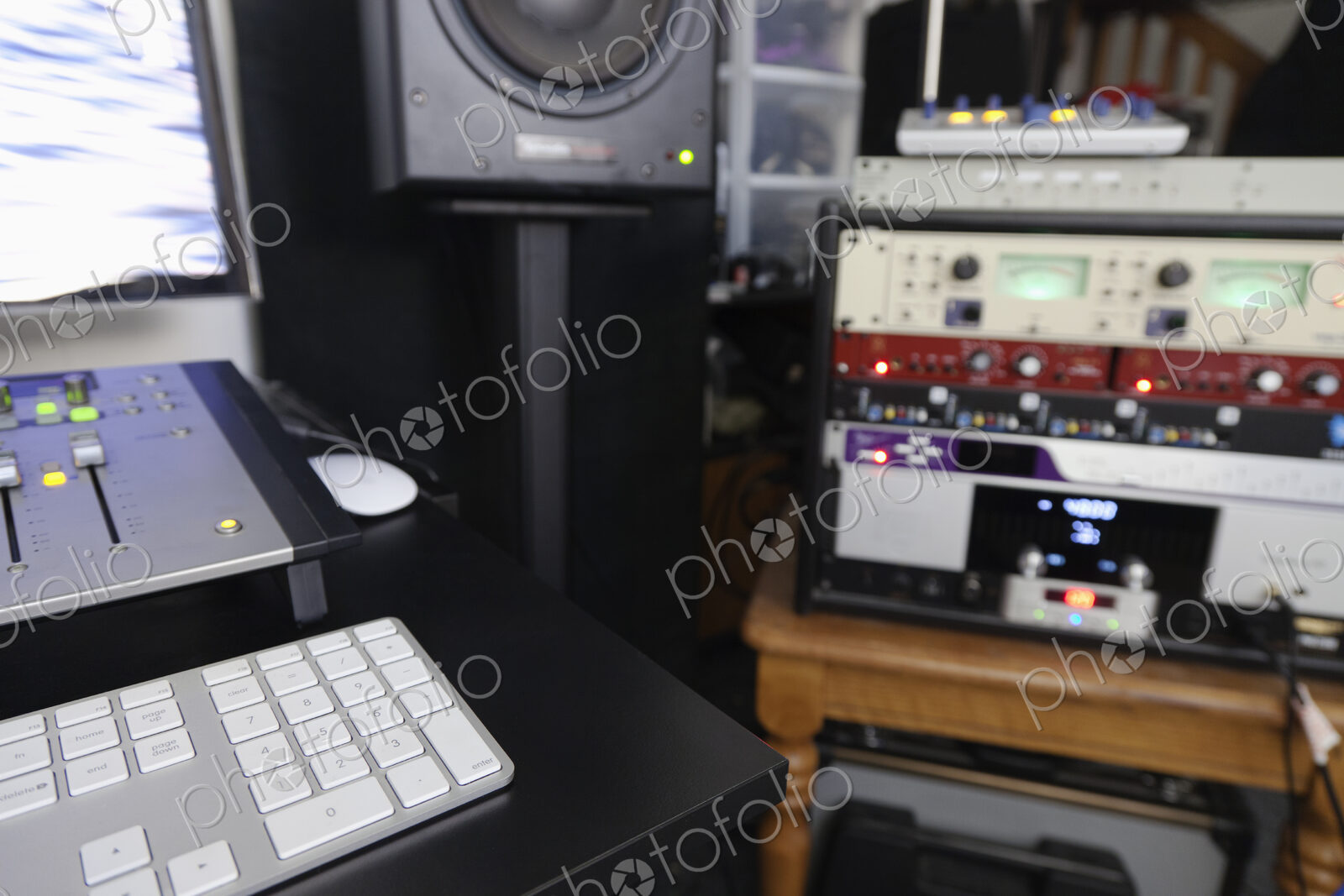 A computer workstation with sound board, speakers, headphones, recording deck and…