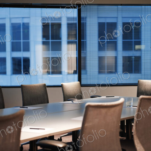 A conference room set up in the early evening.