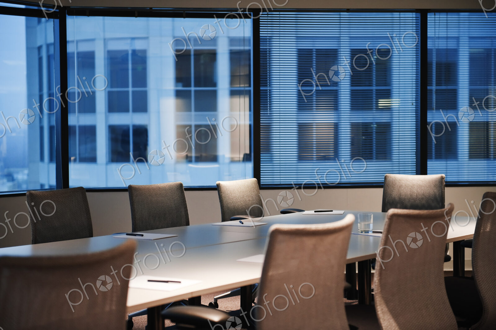 A conference room set up in the early evening.