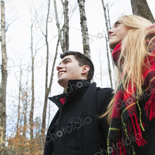 A couple in winter coats outdoors on a winter's day. A couple in winter coats outdoors on a winter's day.