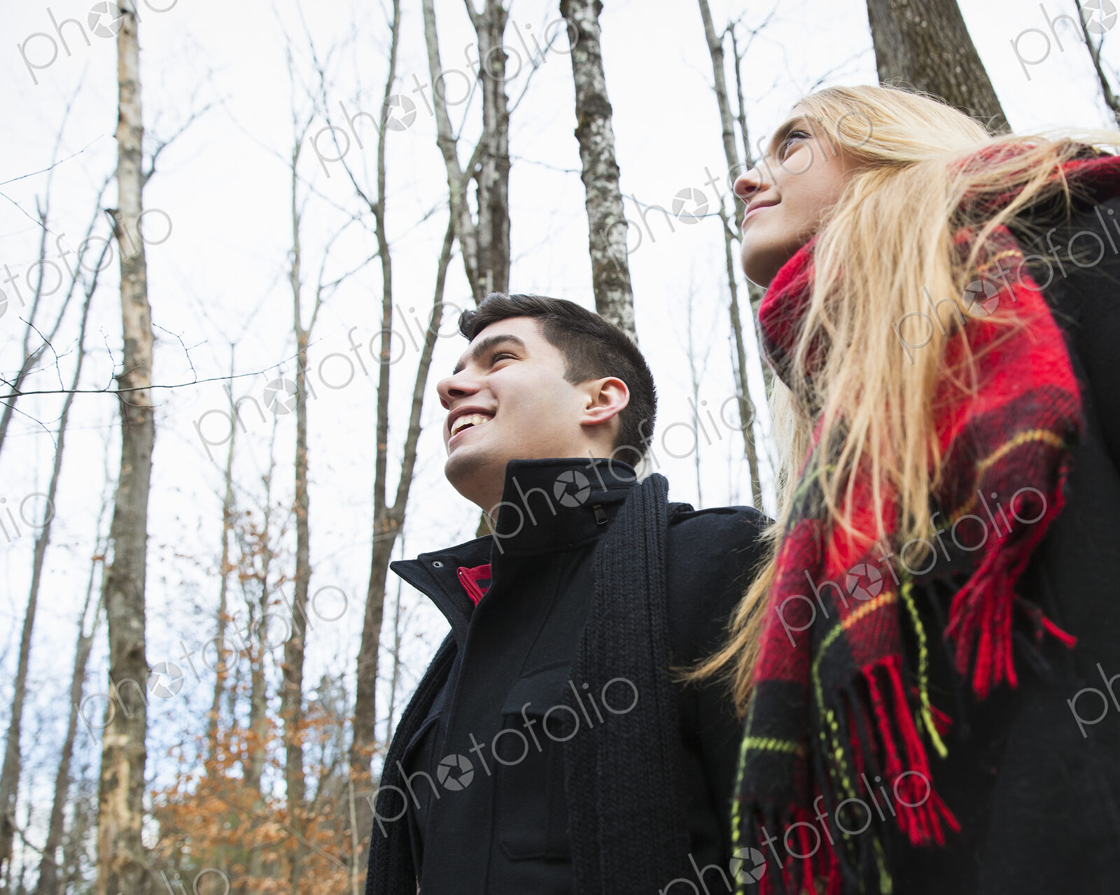 A couple in winter coats outdoors on a winter’s day.