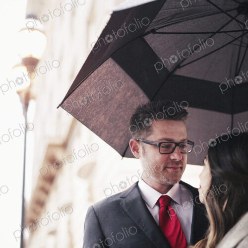 A couple, lovers in the city under an umbrella. A couple, lovers in the city under an umbrella.