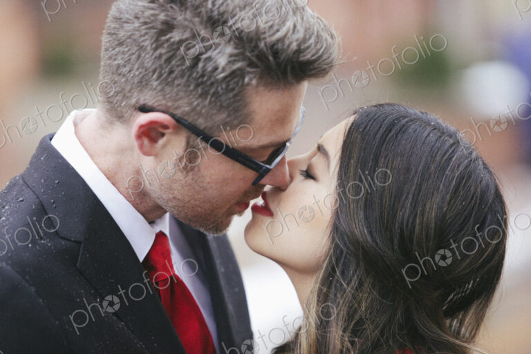 A couple, man and woman kissing.