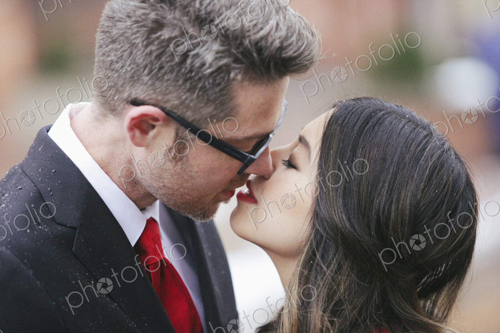 A couple, man and woman kissing.