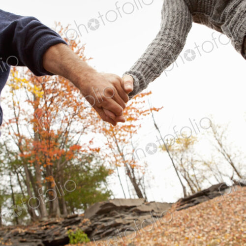 A couple, man and woman on a day out in autumn. Holding hands. A couple, man and woman on a day out in autumn. Holding hands.