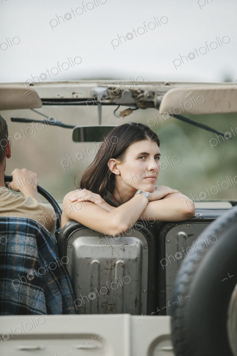 A couple on a road trip in the mountains.