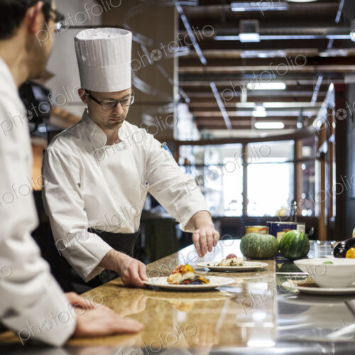A crew of chef's working in a commercial kitchen, A crew of chef's working in a commercial kitchen,