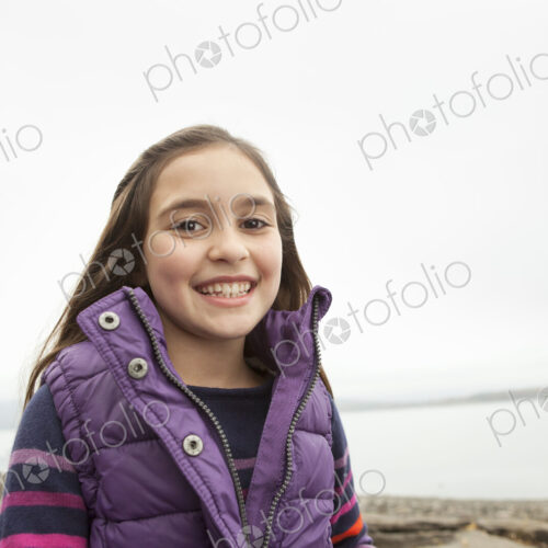A day out at Ashokan lake. A young girl in a purple gilet. A day out at Ashokan lake. A young girl in a purple gilet.