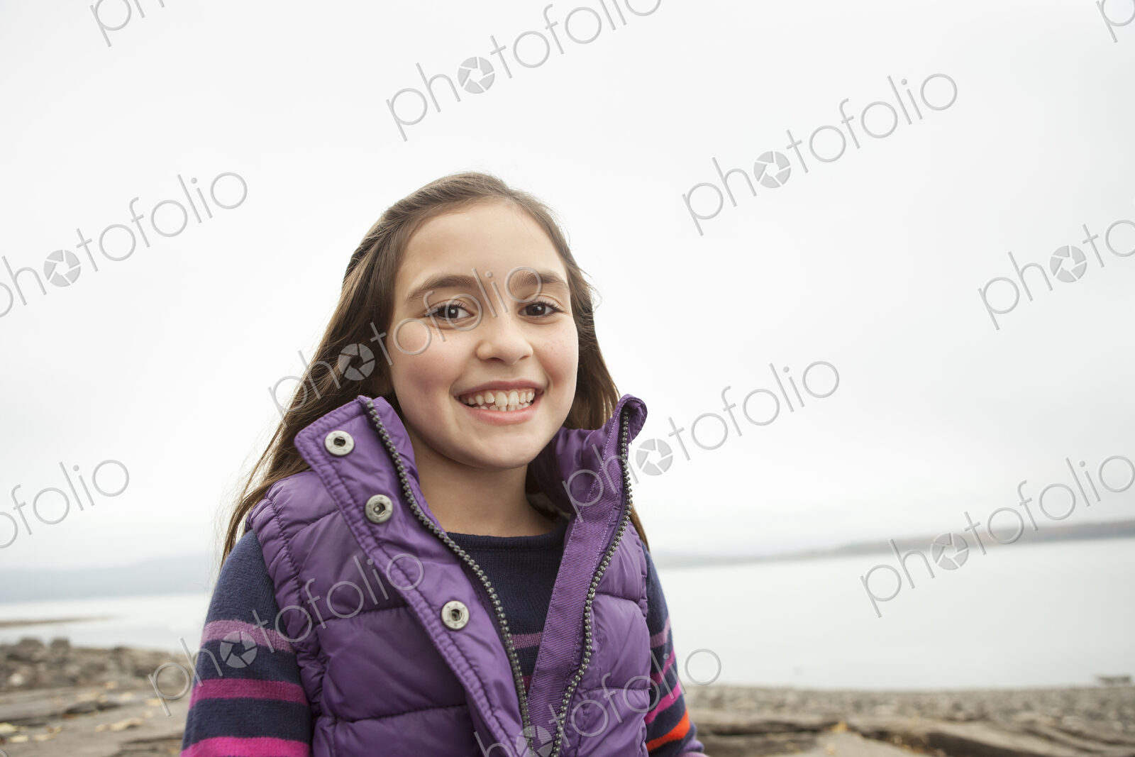 A day out at Ashokan lake. A young girl in a purple gilet.