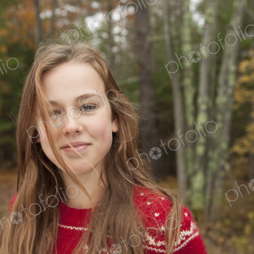 A day out at Ashokan lake. A young girl in a red winter knitted jumper. A day out at Ashokan lake. A young girl in a red winter knitted jumper.