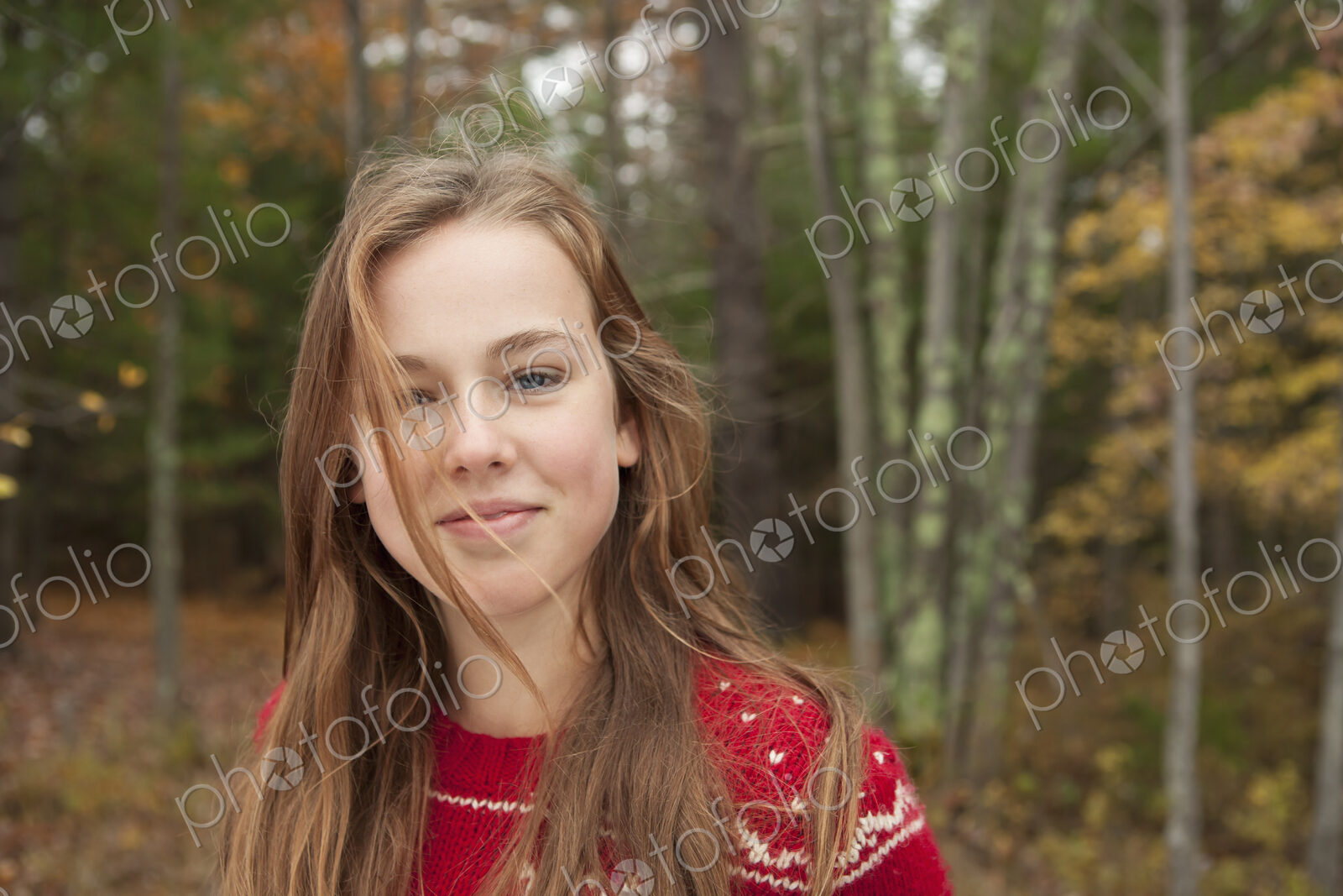 A day out at Ashokan lake. A young girl in a red winter knitted jumper.