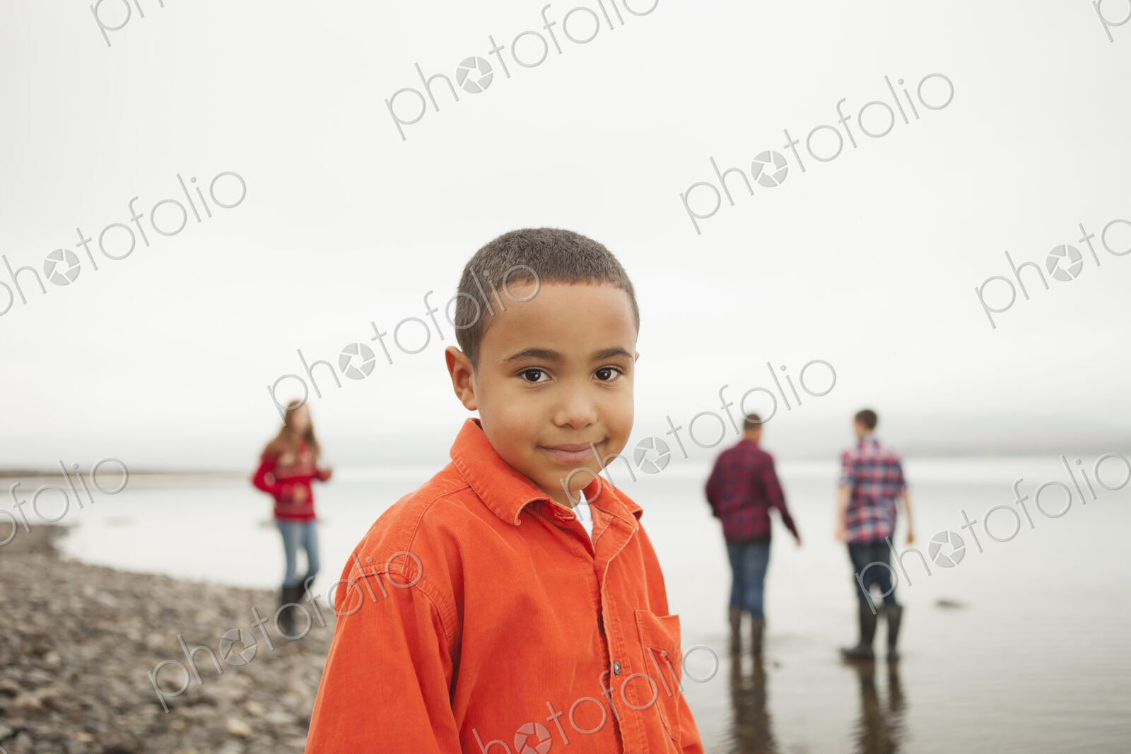 A day out at Ashokan lake. Four young people, boys and a girl, on the shore.