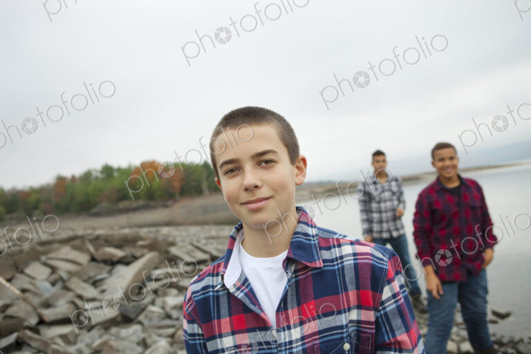 A day out at Ashokan lake. Three boys on the shore.