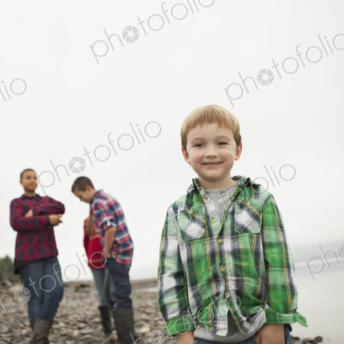 A day out at Ashokan lake. Three teenagers and a young boy on shore. A day out at Ashokan lake. Three teenagers and a young boy on shore.
