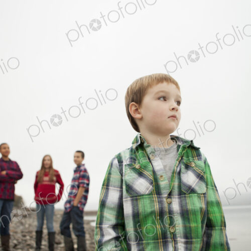 A day out at Ashokan lake. Three teenagers and a young boy on shore. A day out at Ashokan lake. Three teenagers and a young boy on shore.