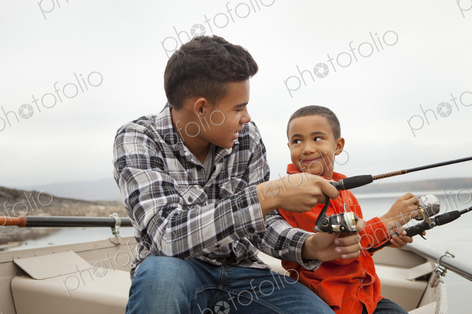 A day out at Ashokan lake. Two boys fishing from a boat.