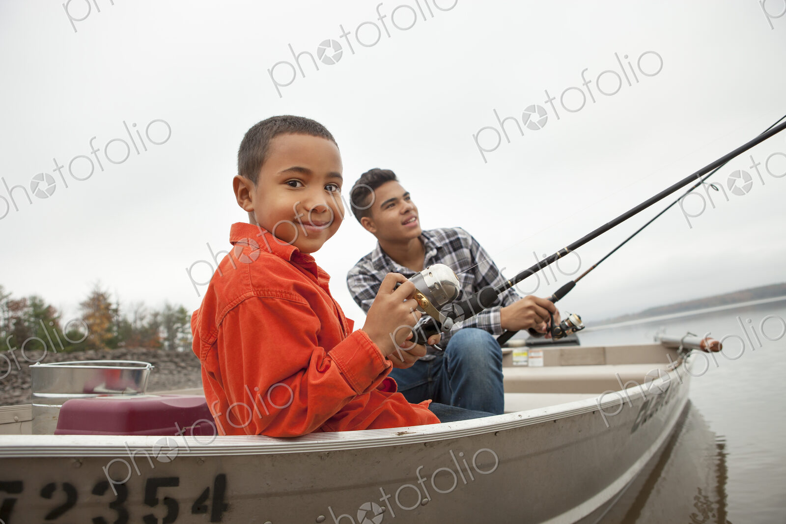 A day out at Ashokan lake. Two boys fishing from a boat.