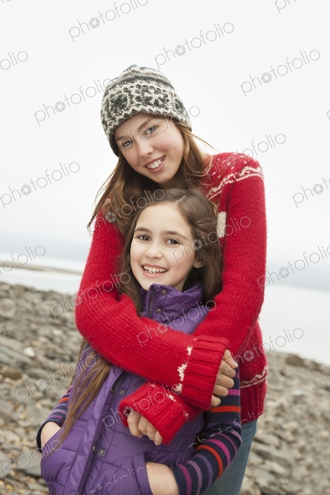 A day out at Ashokan lake. Two girls hugging and looking at the camera.