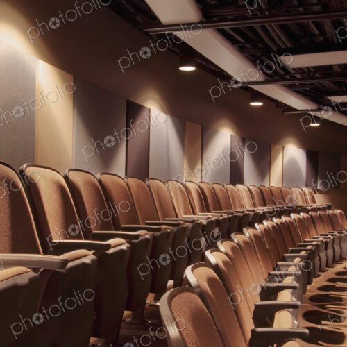 A detail of the audience seating at a live performance theatre. A detail of the audience seating at a live performance theatre.