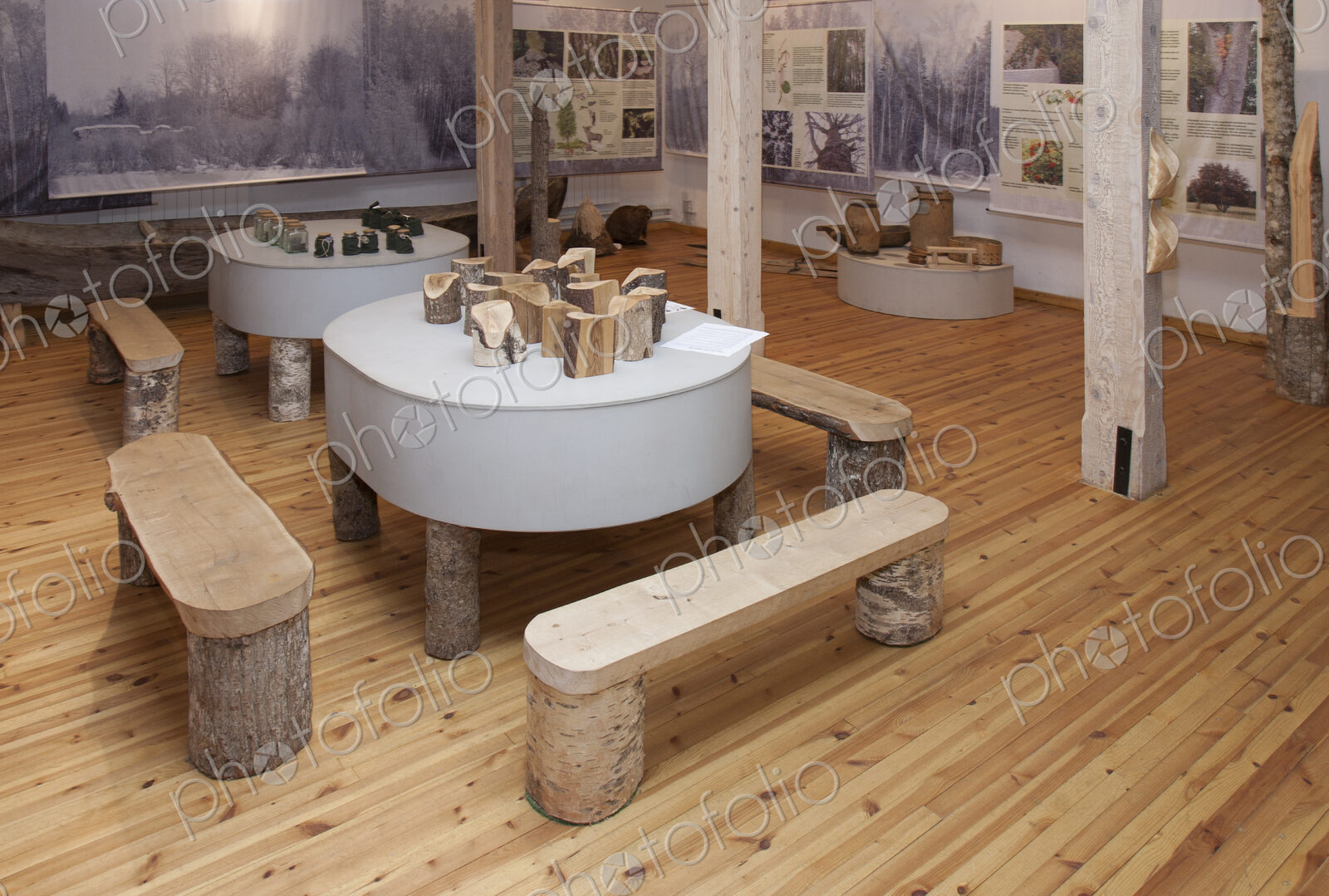 A display of wood and wooden objects, benches and tables in hte Forest Museum at…