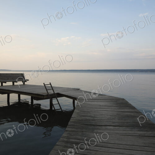 A dock at sunset on Cayuga Lake, New York. A dock at sunset on Cayuga Lake, New York.