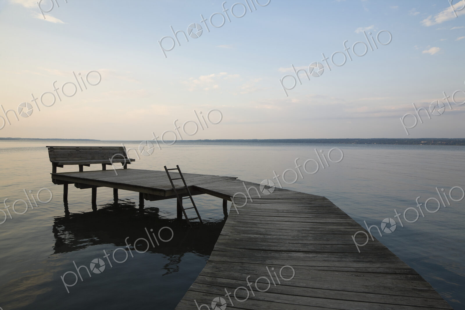 A dock at sunset on Cayuga Lake, New York.