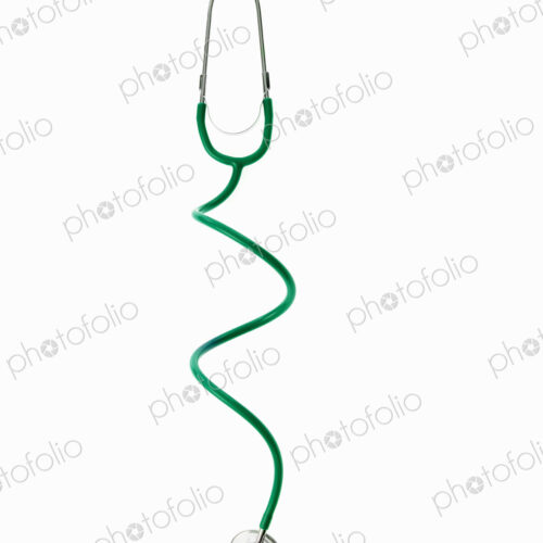 A doctor's stethoscope with green tubing, a conceptual illustration of alternative…