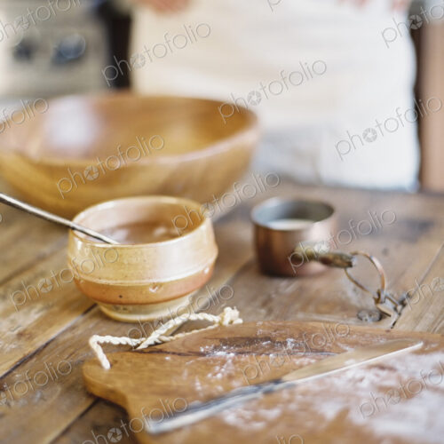 A domestic kitchen. A cook preparing a meal. A large bowl with oill and flour.… A domestic kitchen. A cook preparing a meal. A large bowl with oill and flour.…