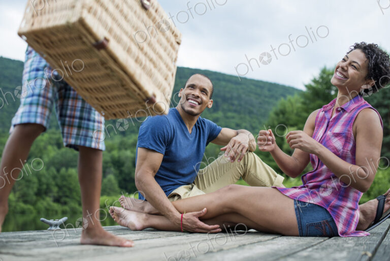 A family having a summer picnic at a lake.