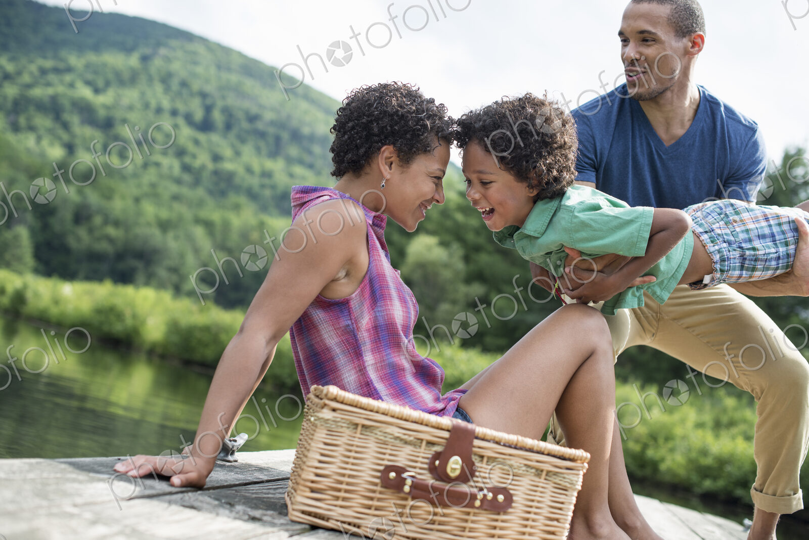 A family having a summer picnic at a lake.