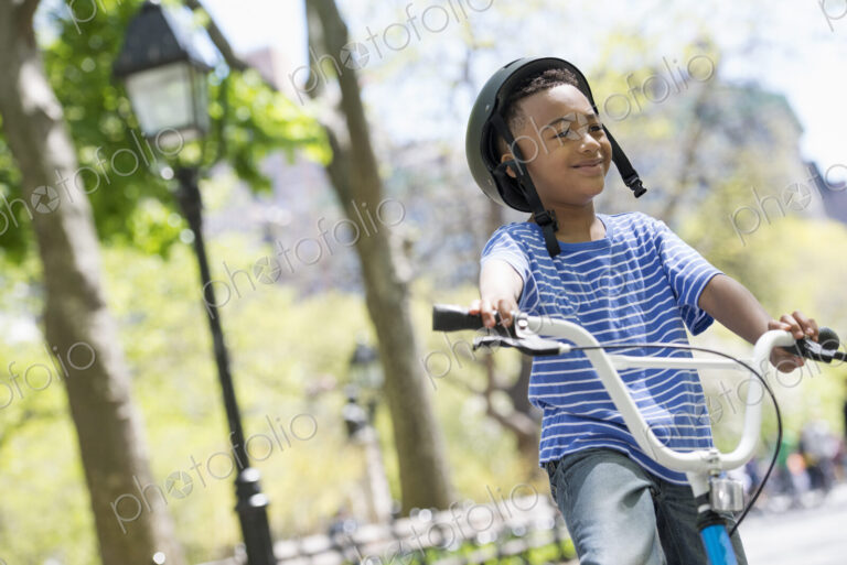 A family in the park on a sunny day. Bicycling and having fun.